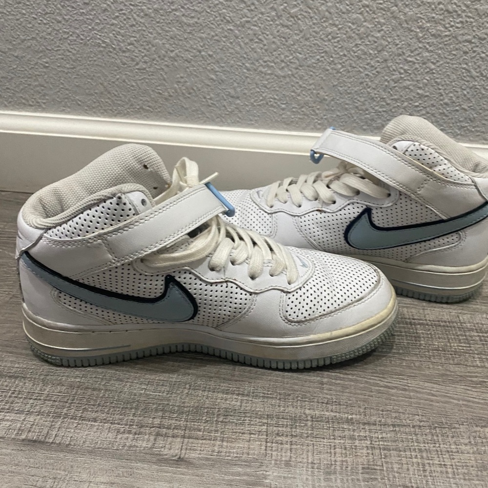 White and blue Nike shoes